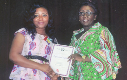 The Deputy Minister of Tourism, Culture and Creative Art, (right) Ms Dzifa Gomashie, presenting a certificate to one of the granduants of Cake Tekniks International Institute.