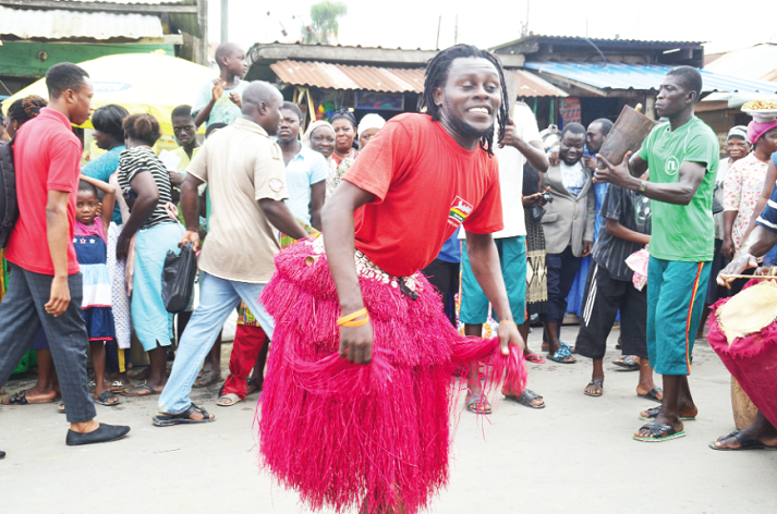 A member of one of the Asafo companies dancing during the procession.