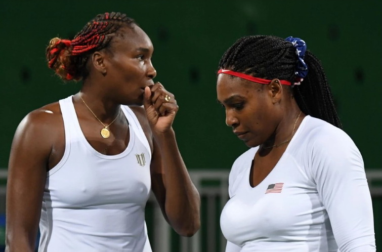 Williams sisters suffer doubles defeat 