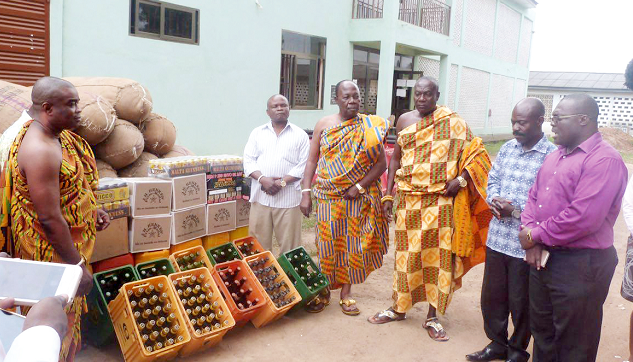 The Municipal Chief Executive of the Ga West Municipal Assembly (GWMA), Mr Sam Atukwei Quaye (right), donating the items to the chiefs