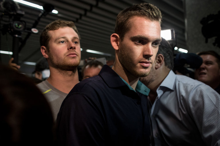 Jack Conger, left, and Gunnar Bentz at Rio de Janeiro’s main international airport after they were pulled off a flight to the United States.