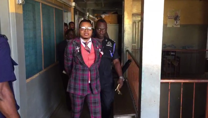 Bishop Daniel Obinim being escorted from the Tema Regional Police office