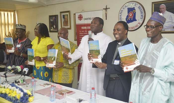 From right: Mr Samuel Zan Akologo, Executive Director of Caritas Ghana; Rev. Fr Dr Anieti Okure of AFJN; Rev. Father Wisdom Larweh, Assistant Secretary General of the National Catholic Secretariat; Mr Ibrahim Tanko Amadu, Programmes Manager of Star Ghana,  and some invited guests jointly launching the land grabbing report. Picture: EMMANUEL QUAYE