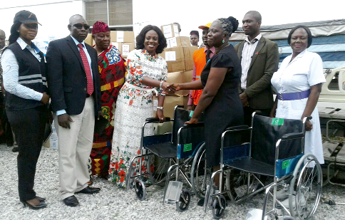 Ms Obuobia Darko Opoku (4th left), the President of the Obuobia Foundation handing over the medical supplies and ambulance to officials of the hospital.