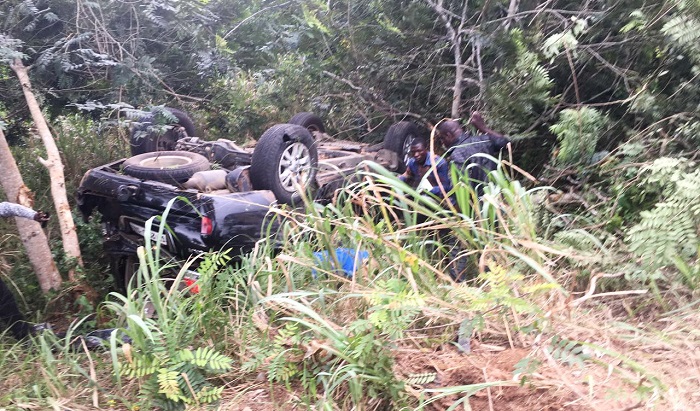 The V8 vehicle lying upside down in the bush 