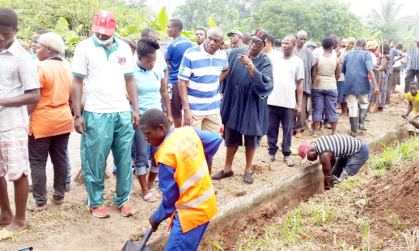 Some residents of the Shai Osudoku Constituency clearing weeds along the road during the exercise last Saturday.