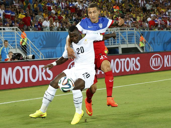 Kwadwo Asamoah holds off his US marker during the 2014 World Cup in Brazil
