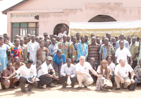 Officials of Swiss Africa and GNPC with some community members