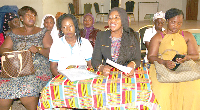 Madam Sarah Ajara Musah (seated middle), flanked by some members of the group, reading the statement on behalf of the women at the press conference Picture:  Samuel Duodu