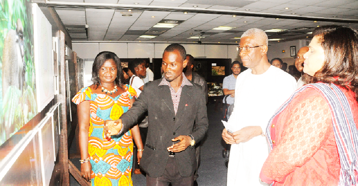 Mr Samuel Acquaah, Education Officer at the  Ghana Museum and Monuments Board, conducting Nii Osa Mills (2nd right), Minister of Lands and Natural Resources, round the exhibition. To his left is Ms Johanna Odonkor Svaniker.  Picture: GABRIEL AHIABOR