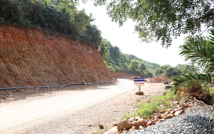 A section of the caved-in portion of the road being worked on.