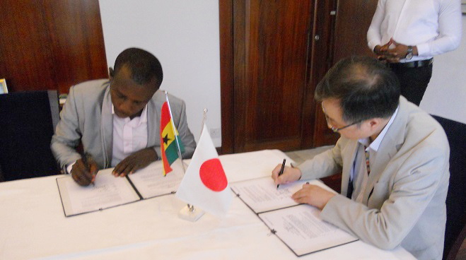 Mr Shigeru Umetsu (right),Deputy Head of Embassy of Mission of  Japan, and Mr Martin Ekow Young(left), Institute Manger of Anum Presby Vocational Training Institute,signing MOU at a ceremony. Picture:ESTHER ADJEI