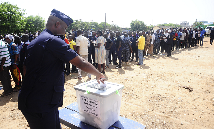  A policeman casting his ballot yesterday, while other special voters wait in a long queue. Picture: EMMANUEL QUAYE
