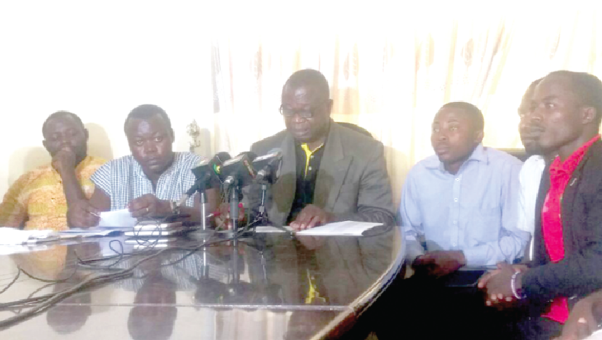 Mr Samuel Antwi (middle) addressing the media in Accra. With him are members of the NEC. 