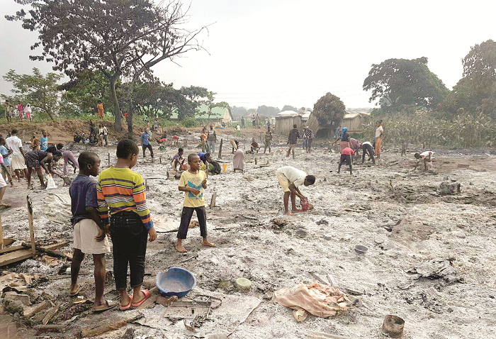  Some of the victims searching through the remains of their homes