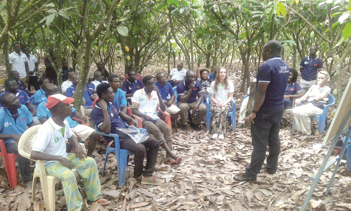  Farmers listening to a teacher during one of the lessons at Sefwi Wiawso