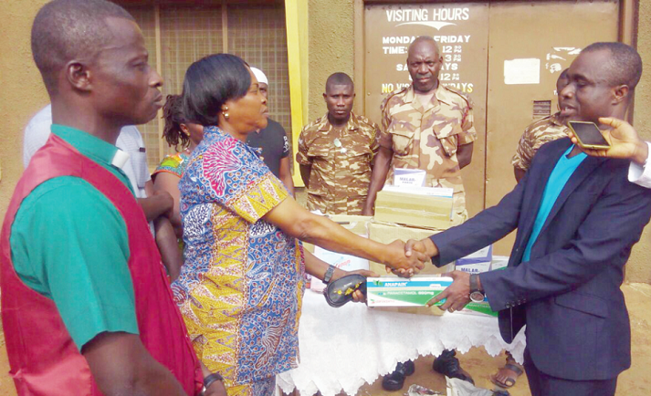 Rev Clement Achim-Gyimah (right), PIWC, Sunyani, presenting the items to Supt. Esther Kofitse of the Sunyani Central Prison