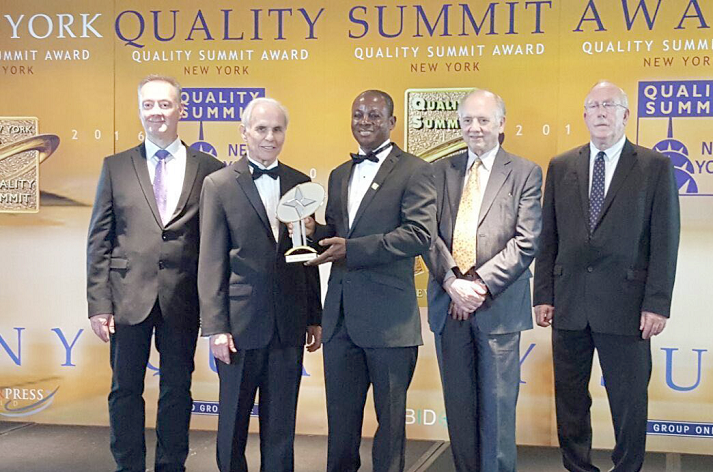  Dr Kwasi Oppong (middle) joined by leaders of the summit to display the award  