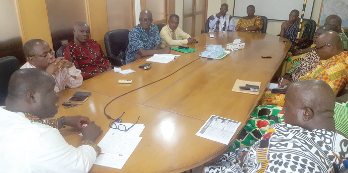  Mr Kenneth Ashigbey (left) holding discussions with Nana Opinamang and his sub-chiefs (2nd right) at his office in Accra. Present were some officials of the Graphic Communications Group Limited