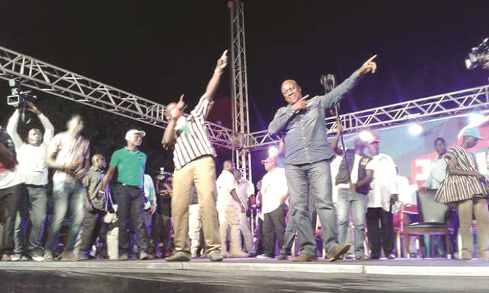 President Mahama and the NDC Parliamentary Candidate for Ashaiman, Mr Ernest Norgbey, doing the 'Bolt' sign at the rally