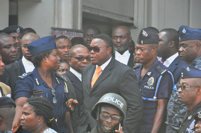  Salifu Masse a.k.a Mugabe accompanied by some police officers after the verdict was given 