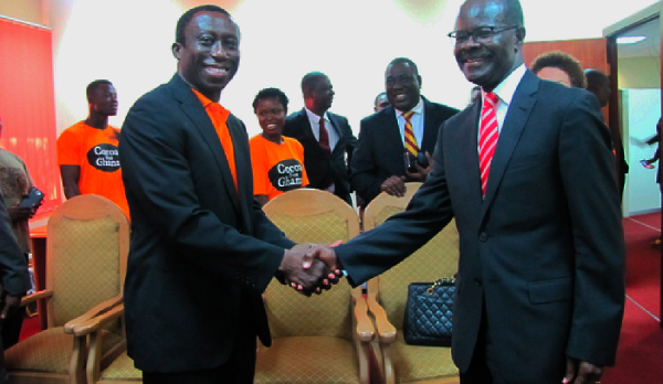 Prof. Dodoo in a handshake with Dr Nduom (right) at the ceremony