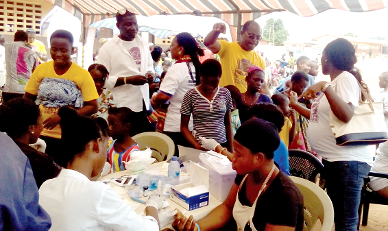  Beneficiaries being screened for blood pressure.