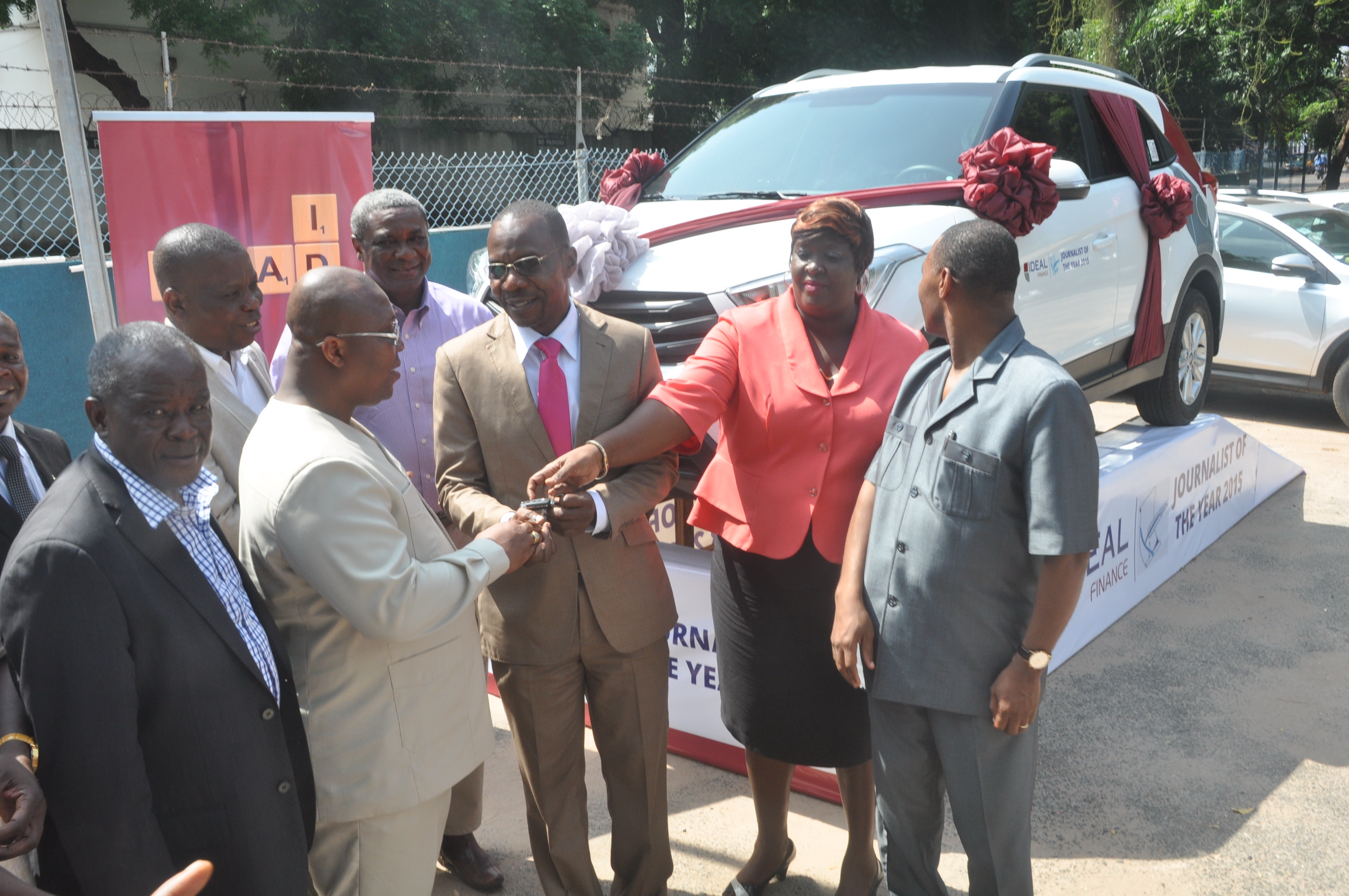 Dr Nii Kotei Dzani (2nd left), Group CEO of Groupe Ideal, presenting the keys to the Hyundai SUV (inset) to Mr Affail Monney (3rd right), President, Ghana Journalists Association, in Accra. Picture: SAMUEL TEI ADANO