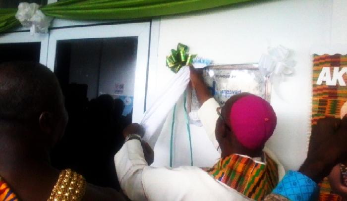 The Most Rev. Mathias Nketsiah unveiling a plaque to inaugurate the maternity block of the hospital.
