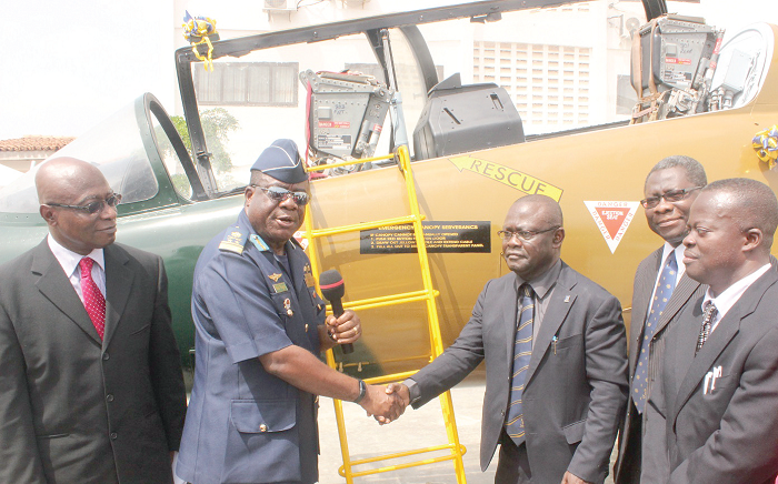  Air Vice Marshall Maxwell Nagai (2nd left), handing over the decommissioned Aermacchi MB339 aircraft to Prof. Boateng-Agyeman, while other officials look on. Pictures: NII MARTEY M. BOTCHWAY