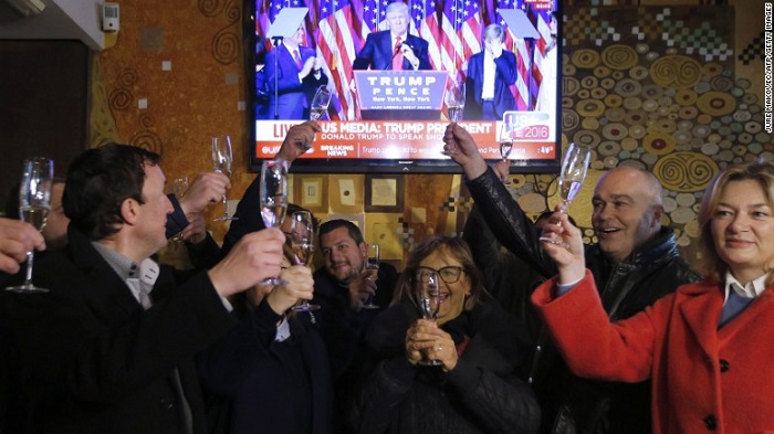Slovenians toast Donald Trump's victory in Sevnica, the hometown of Trump's wife, Melania, during a broadcast of his acceptance speech on Wednesday, November 9. Trump defeated Democratic presidential nominee Hillary Clinton and will become the 45th president of the United States.