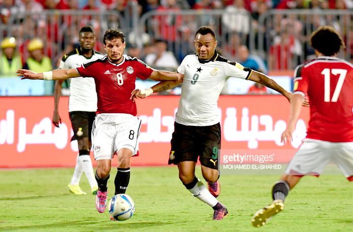 Black Stars’ Jordan Ayew gains the upper hand during a tussle for the ball with Tarek  Hamed of Egypt