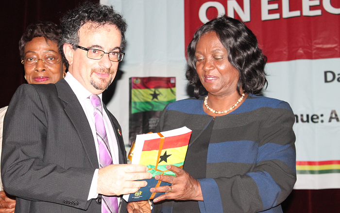  Mrs Georgina Theodora Wood (right) presenting a copy of the 3rd Edition of Manual on Election Adjudication in Ghana to Mr Jon Benjamin, the British High Commissioner to Ghana. Picture: MAXWELL OLCOO