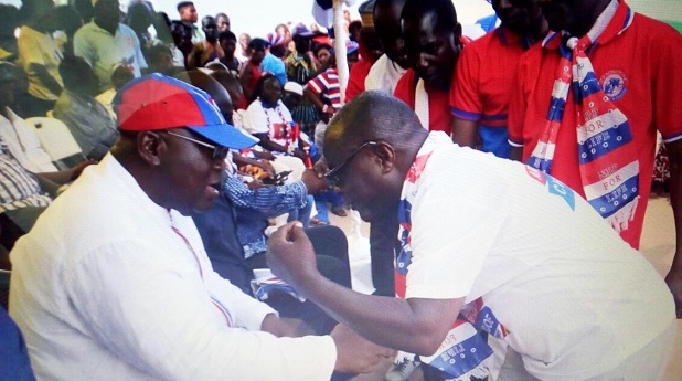 Nana Akufo-Addo interacting with Mr Ekow Esilfi Buckman, a former ndc chairman of Ekumfi, during a tour of the Central Region. Picture: SAMUEL TEI ADANO