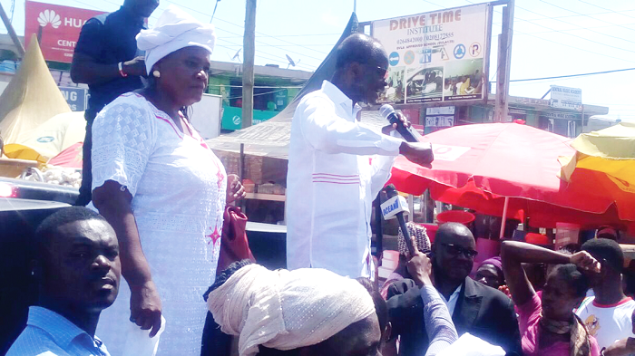 Dr Nduom addressing electorate at Abura in Cape Coast. With him is the parliamentary candidate for Cape Coast North, Mrs Sarah Bucknor.