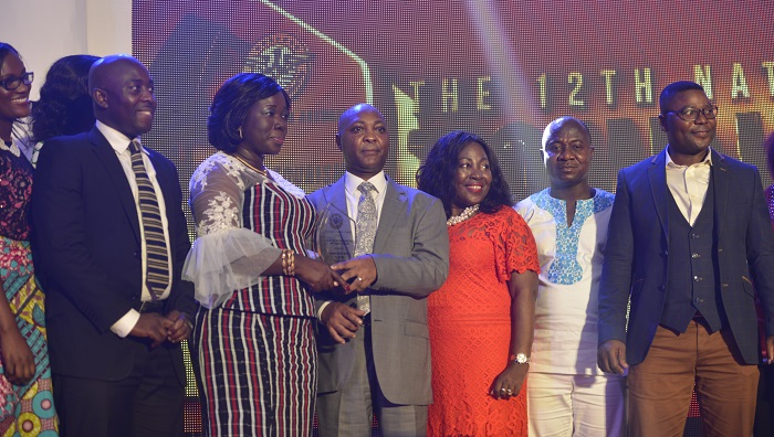 Mrs Elizabeth Ofosu-Agyare  presenting the Five Star Hotel of the Year award to Mr Charles Njeru (4th right), Financial Controller of Labadi Beach Hotel. Picture: EMMANUEL QUAYE
