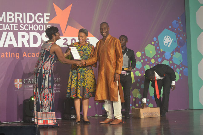 Mrs Theresa Sackey from Schoolbox Plus presenting the award to the Principal of Alpha Beta Educational Centre, Mrs Florence Adjepong and Mr Samuel Adjepong, Director of Alpha Beta School