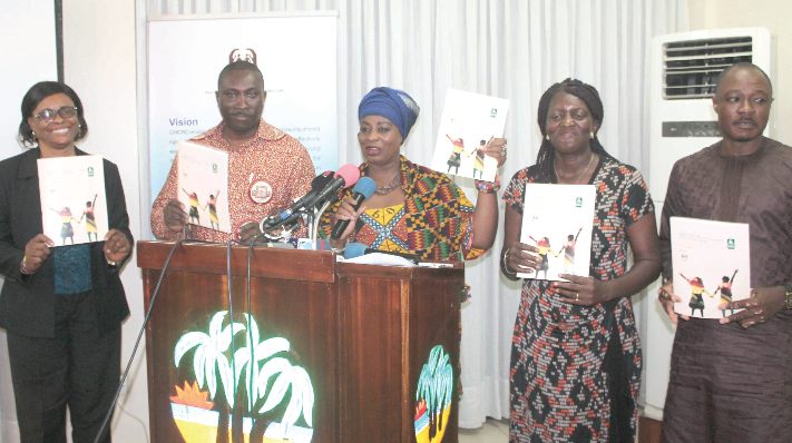 Nana Adwoa Awindor (3rd right), Mrs Laurencia Akorli (left), Madam Josephine Konadu Koduah (2nd right), Mr Hussein A. Rahman (right) and Mr Edmond Vanderpuye (2nd left) displaying the report.