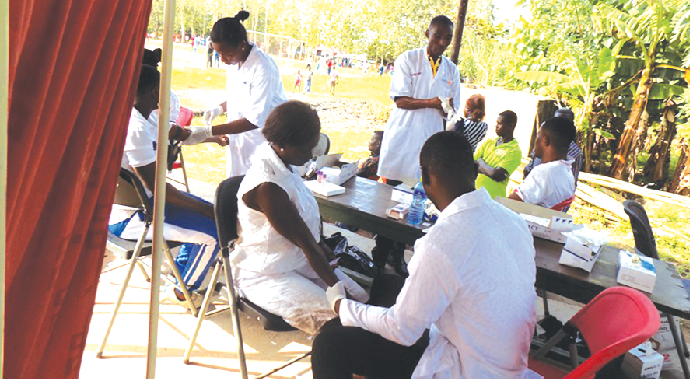 Some members of the military health team attending to patients during the free health screening exercise