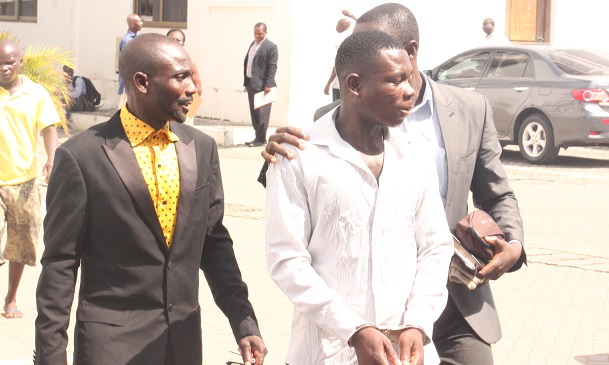 Mr David Azeole (in handcuff) being escorted to begin his sentence. Picture: NII MARTEY M. BOTCHWAY