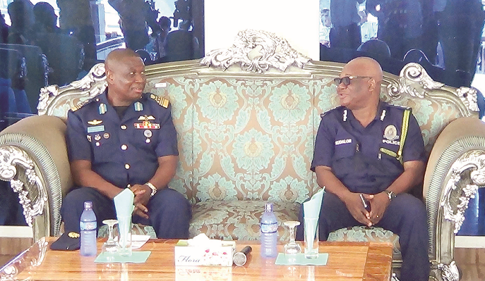  Air Marshal Simson Oje (left), CDS, having a tete-a-tete with IGP John Kudalor (right) during the media interaction at the Air Force Officers' Mess in Accra. PICTURE: OWUSU INNOCENT.