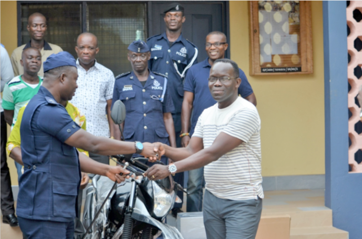  Dr Steve Ogbordjor (right) presenting the motorbike with its keys to the Konongo Divisional Police Commander, Superintendent Bossman Ohene-Boadi 