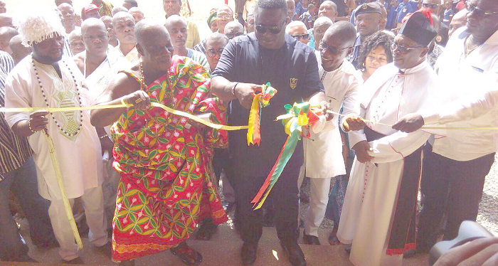   Mr Joseph Nii Laryea Afotey-Agbo, Greater Accra Regional Minister,  joined by Mr Isaac Ashai Odamtten, MCE for Tema, and Nii Adjei Krakue II, Tema Mantse, to cut the tape to inaugurate the new school block