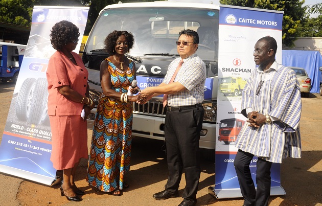 Mr Emmanuel Akpozo (right), Sales Executive of Michael Star Company Limited, presenting cash and outboard motors to Ms Sherry Ayittey (left)