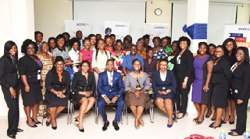 Some management of Access Bank (seated) in a pose with participants after the training