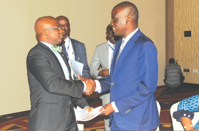 • Mr Haruna Iddrisu (right), Minister of Employment and Labour Relations, exchanging a document with Mr Moussa Dosso, Minister of Employment and Social Protection, after signing the agreement