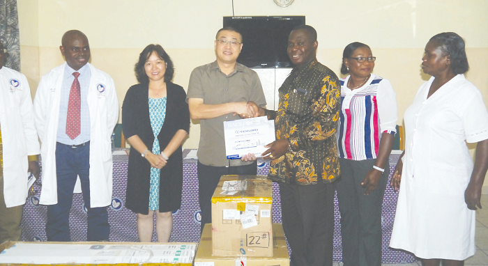 Mr Li Jiang (3th left), Economic and Commercial Counsellor’s Office Embassy of the People’s Republic of China, donating some items to Dr Lawrence Agyeman Serebour (3th right), Director of National Cardiothoracic Centre. Picture: PATRICK DICKSON