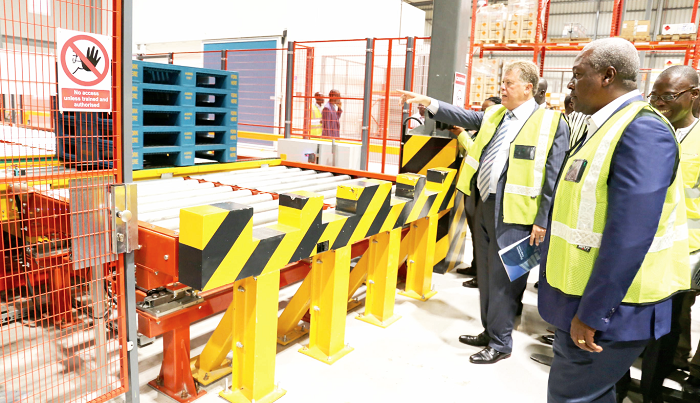 Mr Marwan Traboulsi (right), Chairman, CEO, Air Ghana, explaining some of the processes at the cargo centre to President Mahama  after the opening of the facility. Picture:SAMUEL TEI ADANO