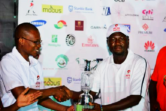  Gabriel T. Korley (right) receiving his trophy from Richard Adiase, Head of Airtel Business
