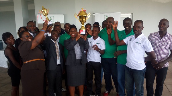 Staff of NDK and players of NDK Financiers pose with the trophies
